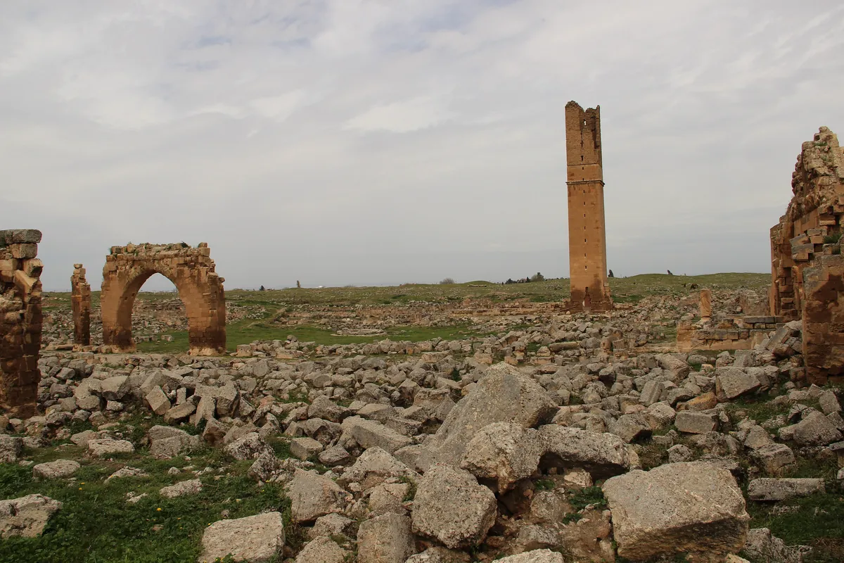 Stone ruins, an arch and a lone tower on the plain of Harran